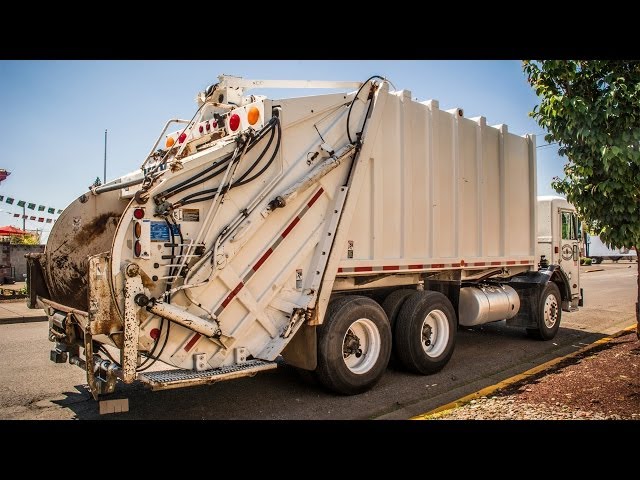 Leach 2RII Rear Load Garbage Truck Collecting Commercial Dumpsters