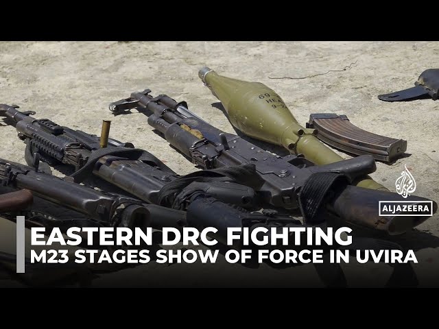 M23 rebels display seized arms in the captured DRC city of Uvira
