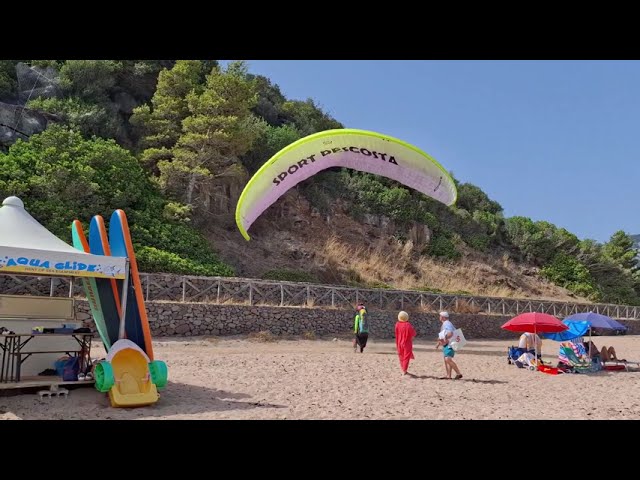 Paraglider lands on the beach Sardegna [Cala Gonone] #italy #vacation