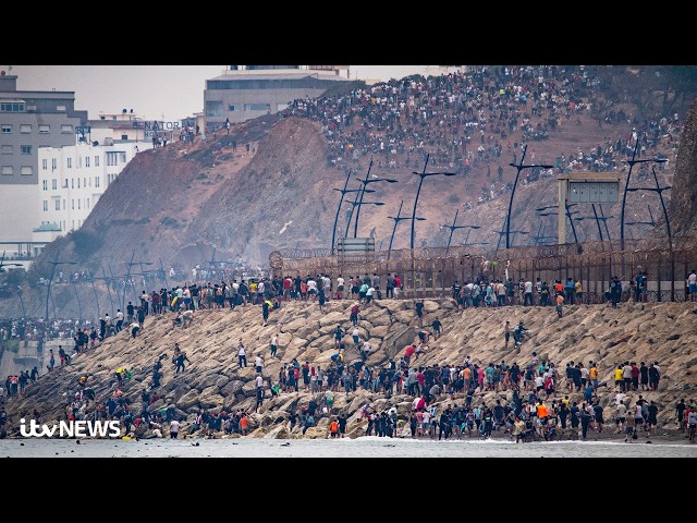 Watch as tens of thousands of migrants cross border from Morocco into Spain