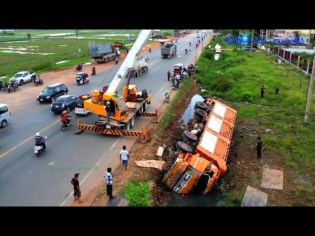 A video documentary of all overturned and crushed earth moving truck with the help of crane experts
