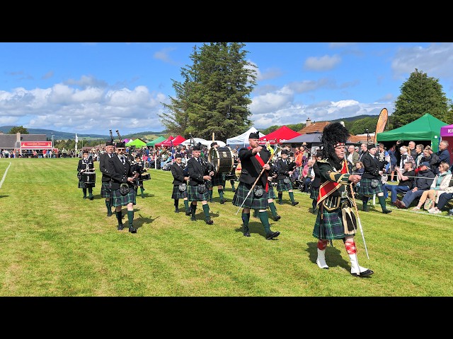 Scotland the Brave as Drum Major leads Forres Pipe Band march during 2026 Dufftown Highland Games