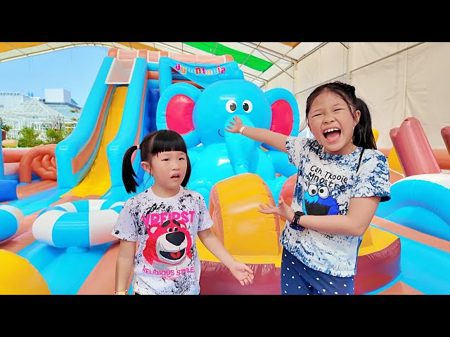The Fun of Playing on the Slide at the Elephant Balloon Palace, a Night Market Game