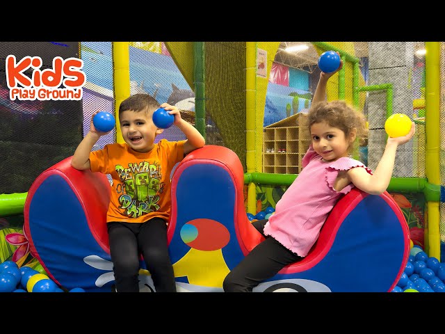 Neva and Nali enjoy playing with Mommy at the playground