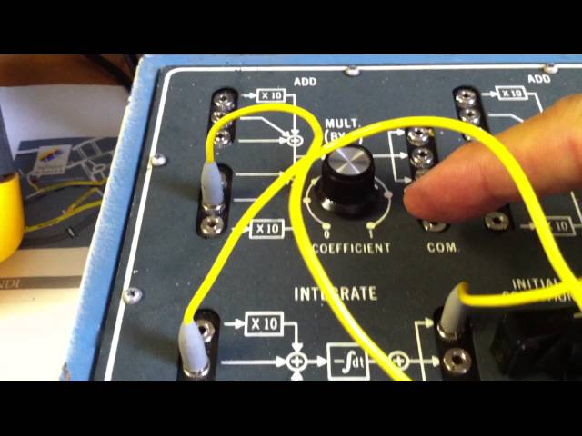Solving the differential equation of a damped oscillator using a vintage analog AMF665D computer