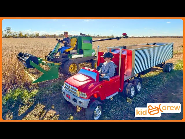 Miniature kids combine harvesting soybeans on farm with semi truck. Educational | Kid Crew