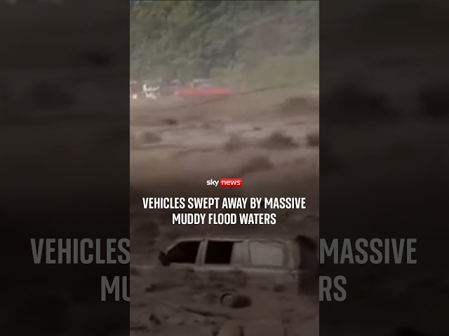 Vehicles swept away by massive muddy flood waters