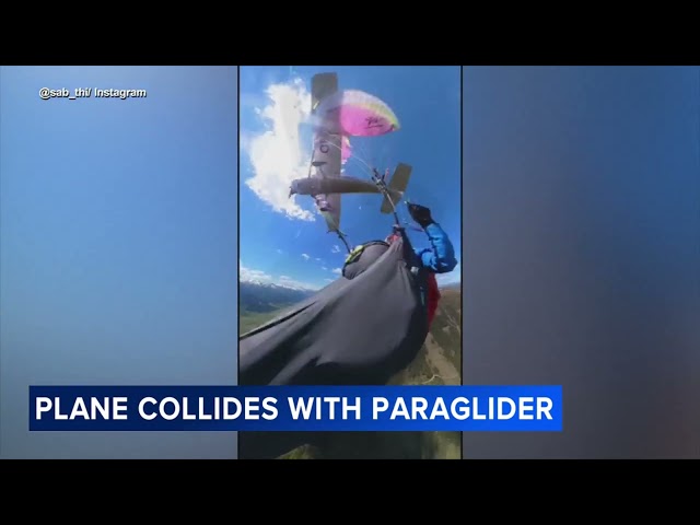 Video shows the terrifying moment a paraglider was struck by a plane.