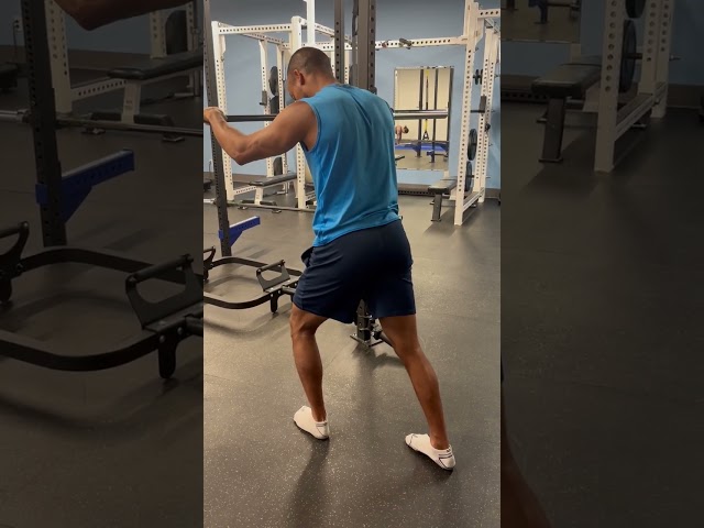 Wall or bar assisted lunge position back leg calf stretch drill