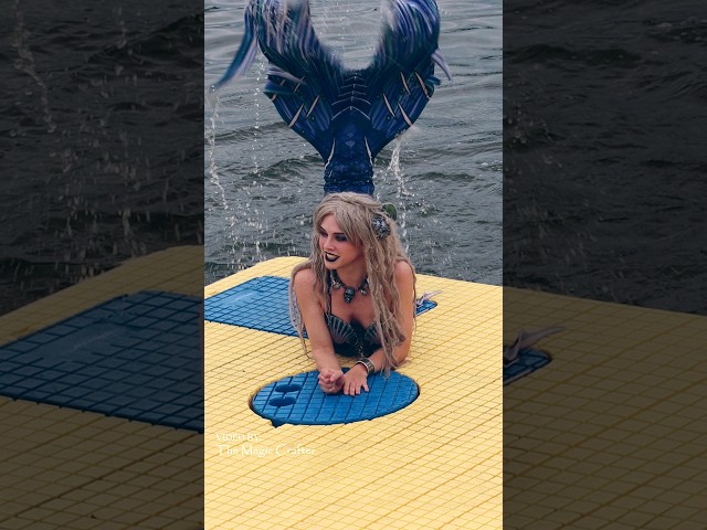 Mermaid climbs onto a raft and splashes around (East Jordan, MI)