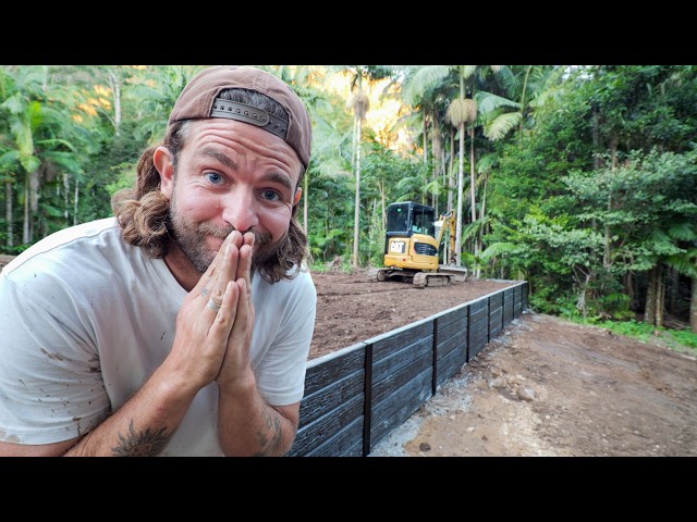 Old excavator builds massive retaining wall