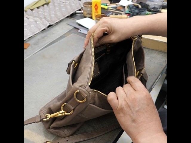 The amazing process of upcycling a Prada bag into a cute crossbody bag.