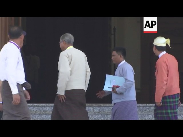 New president Htin Kyaw takes Suu Kyi to car