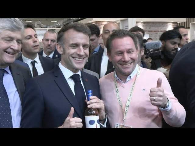 Macron receives a bottle of wine with 'For Sure' label inspired by his viral Davos appearance | AFP