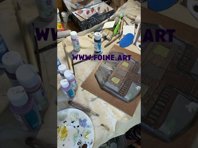 Applying underglazes to create an Acadian style home.