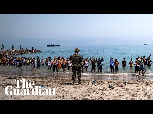 Tens of thousands of migrants cross into Spanish enclave from Morocco
