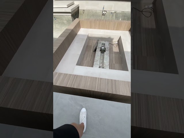 This sunken seating area design needs no steps! 👀 #luxuryhome #pool #firepit #landscapedesign