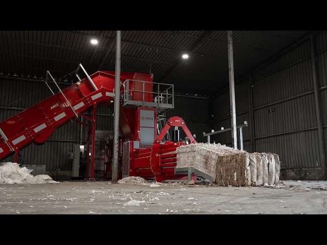 ANIS Channel Waste Baler model ATS110-75S-5V with a robust TGV14-150 in-pit conveyor