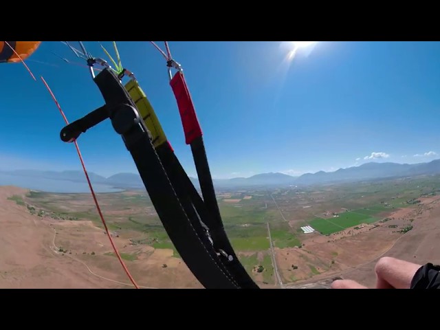 Relaxing paraglide flight over West mountain, Utah