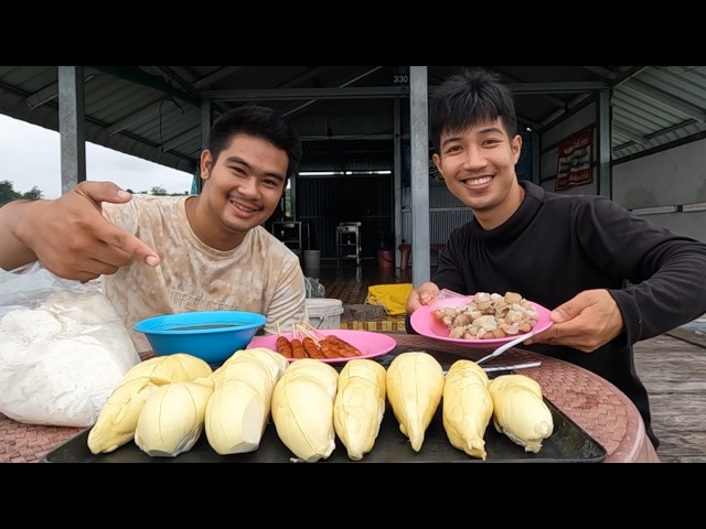 Fishing on a reservoir raft and bringing durian for Mix to feast on.
