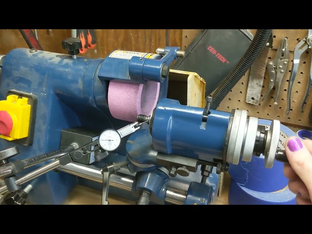 Indicating part on dbit grinder