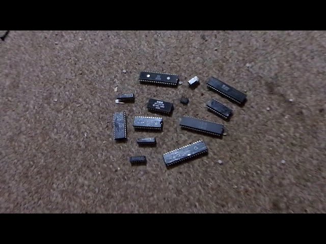 1071-2049 13 microchips from 1980s electronics. 3