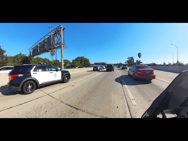 Harley Pan America lane filtering through L.A. rush hour traffic