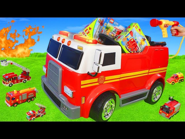 Le camion de pompier avec des jouets équipement d'incendie