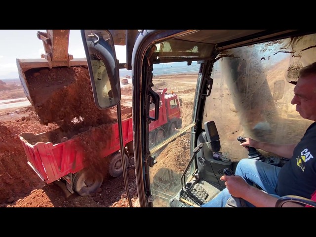 Caterpillar 365C Excavator Loading Soil On Trucks - Operator View