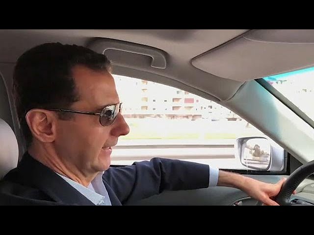 Assad filmed driving himself to the front lines of Syrian civil war
