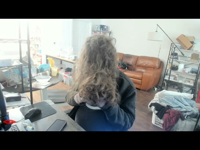 Combing my hair before taking a shower